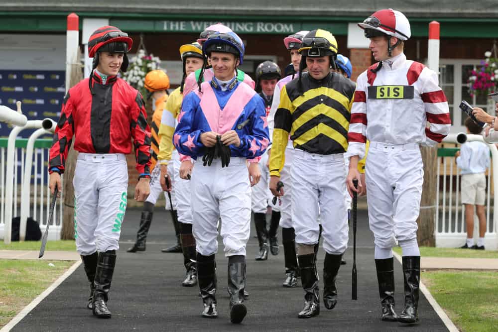 Jockeys walking together